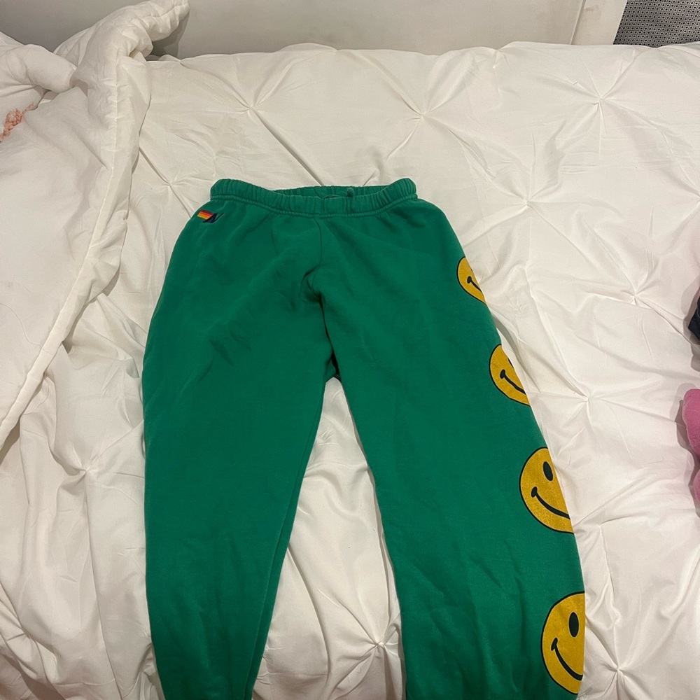 Green smiley face aviator nation sweatpants // size small in women’s)